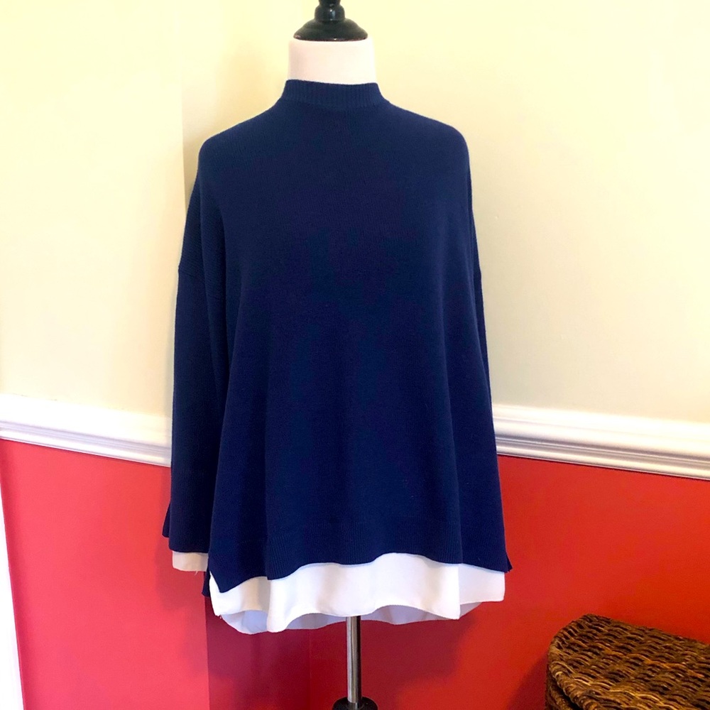 Chicos size 3 Blue crew neck sweater with peek out white cuffs & shirt tail
